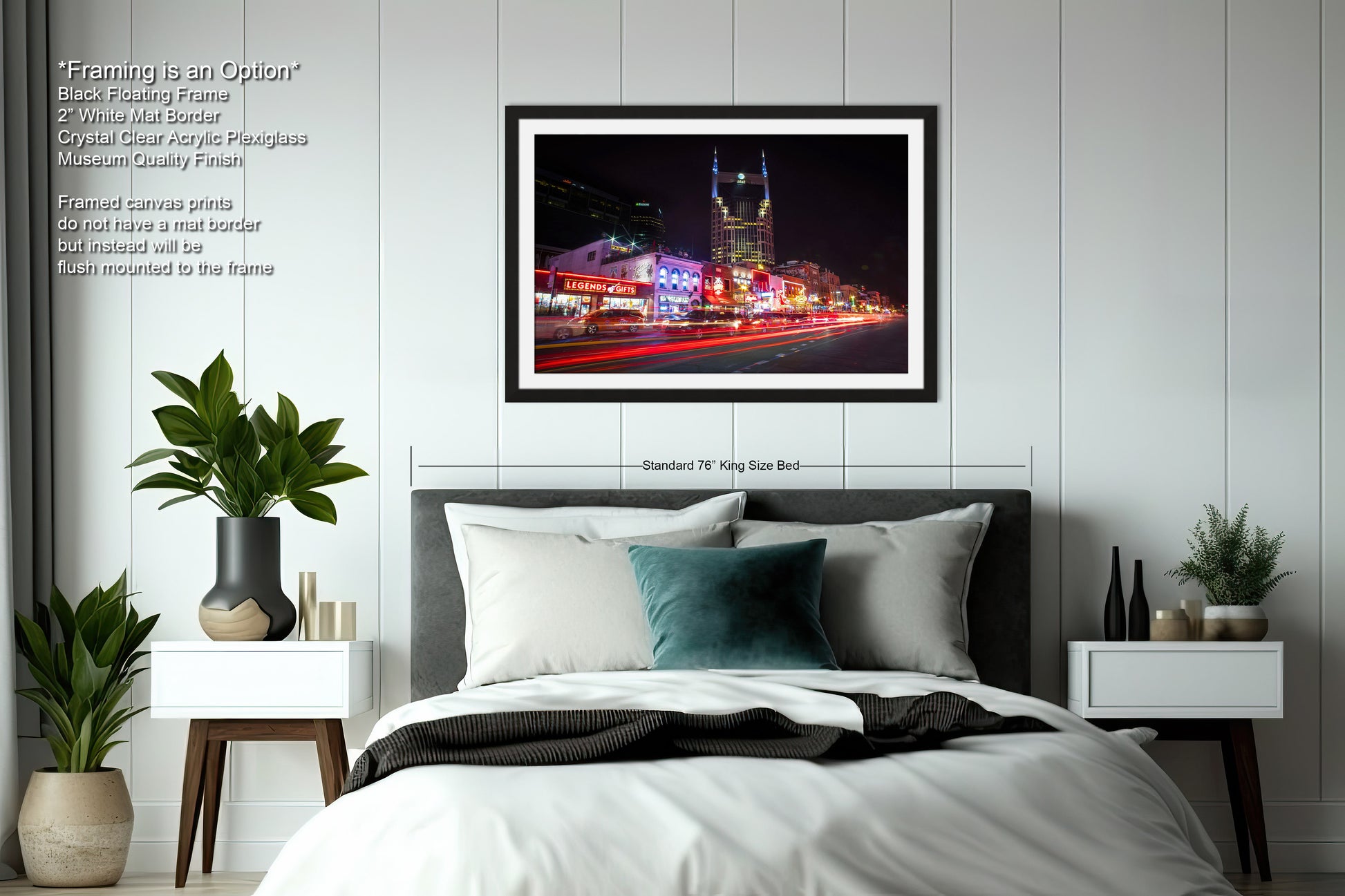 a bedroom with a large bed and a picture hanging on the wall
