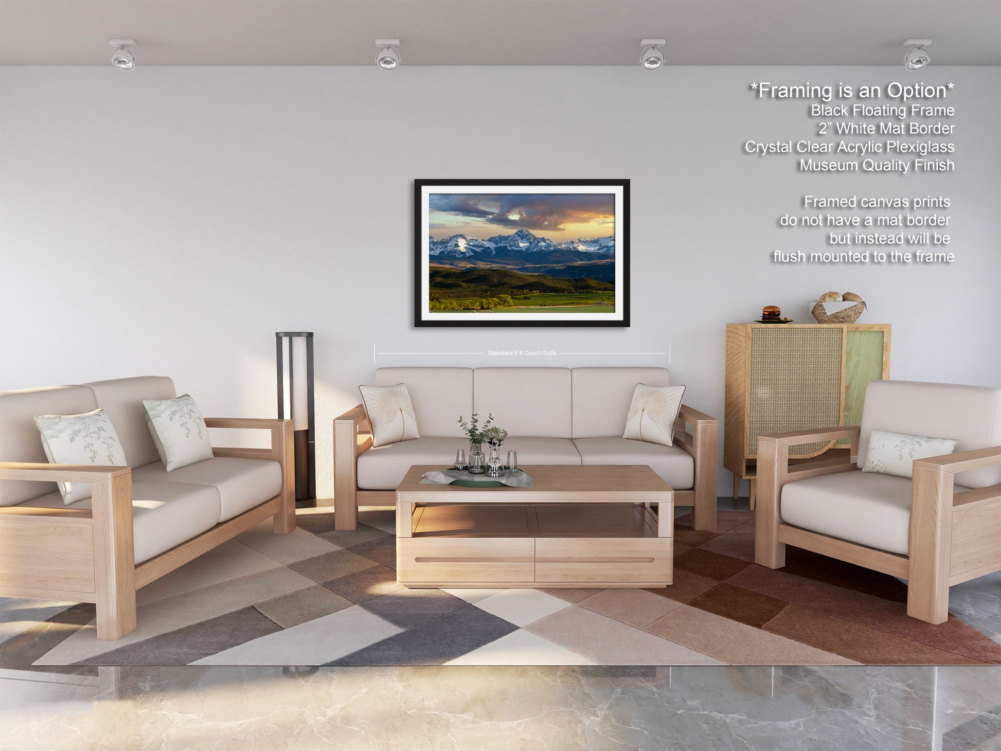 a modern living room with a large framed landscape painting hanging on the wall. The room is furnished with a sofa, two armchairs, and a coffee table, creating a comfortable and inviting atmosphere.