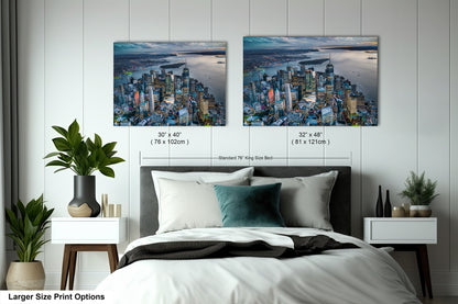 a bedroom with a bed and two pictures on the wall