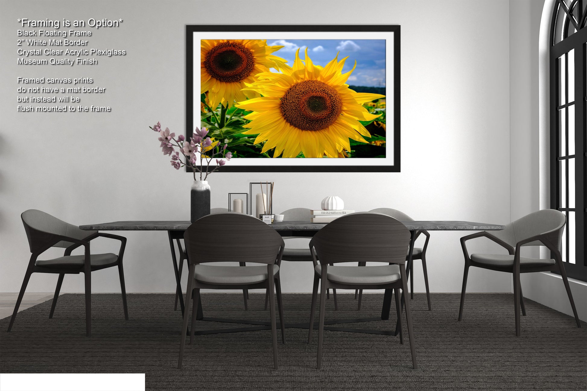 a picture of a table with four chairs and a vase of sunflowers