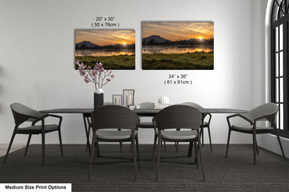a dining room table with chairs and a vase of flowers