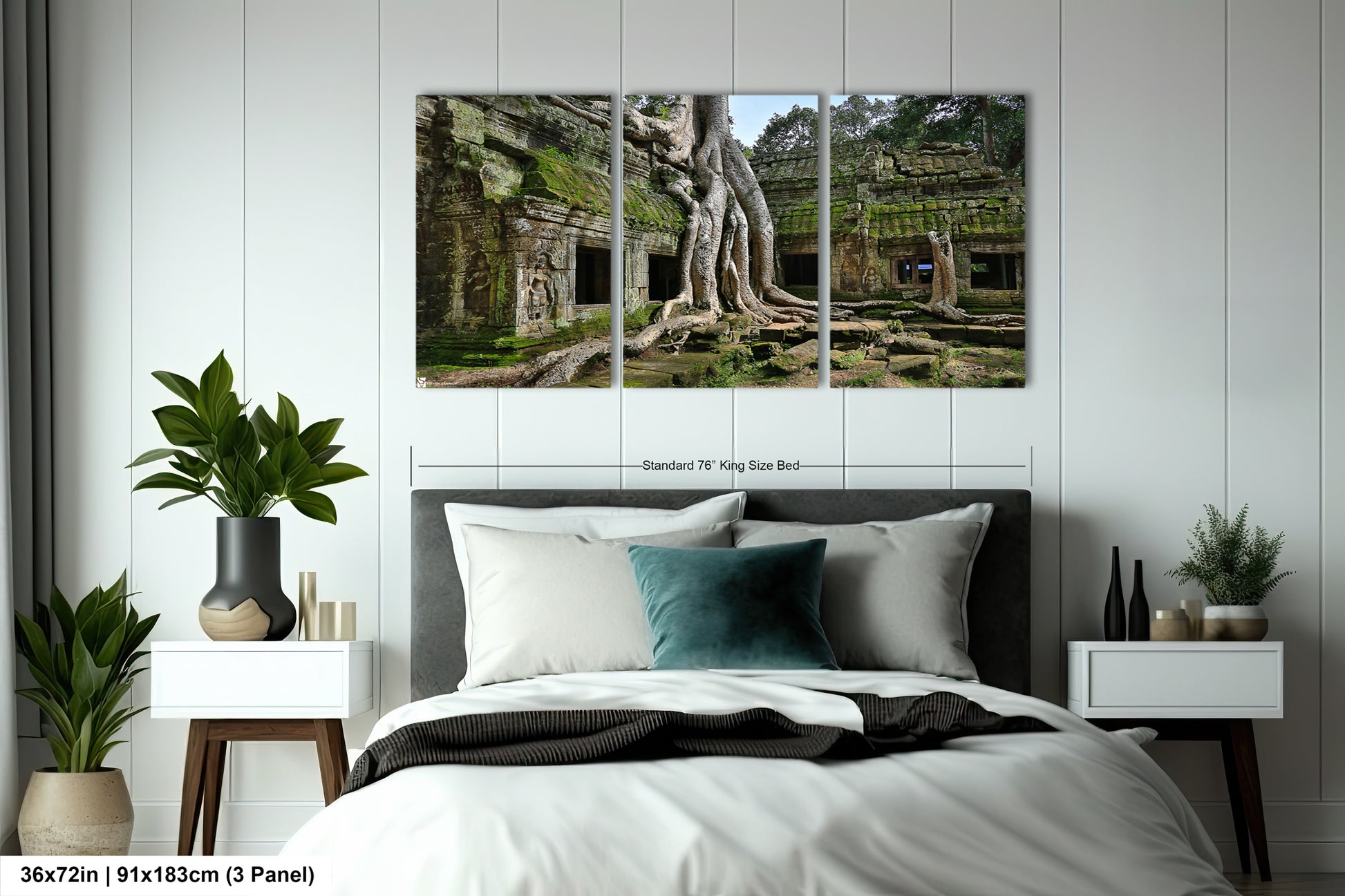 a bed with a white comforter and two paintings on the wall