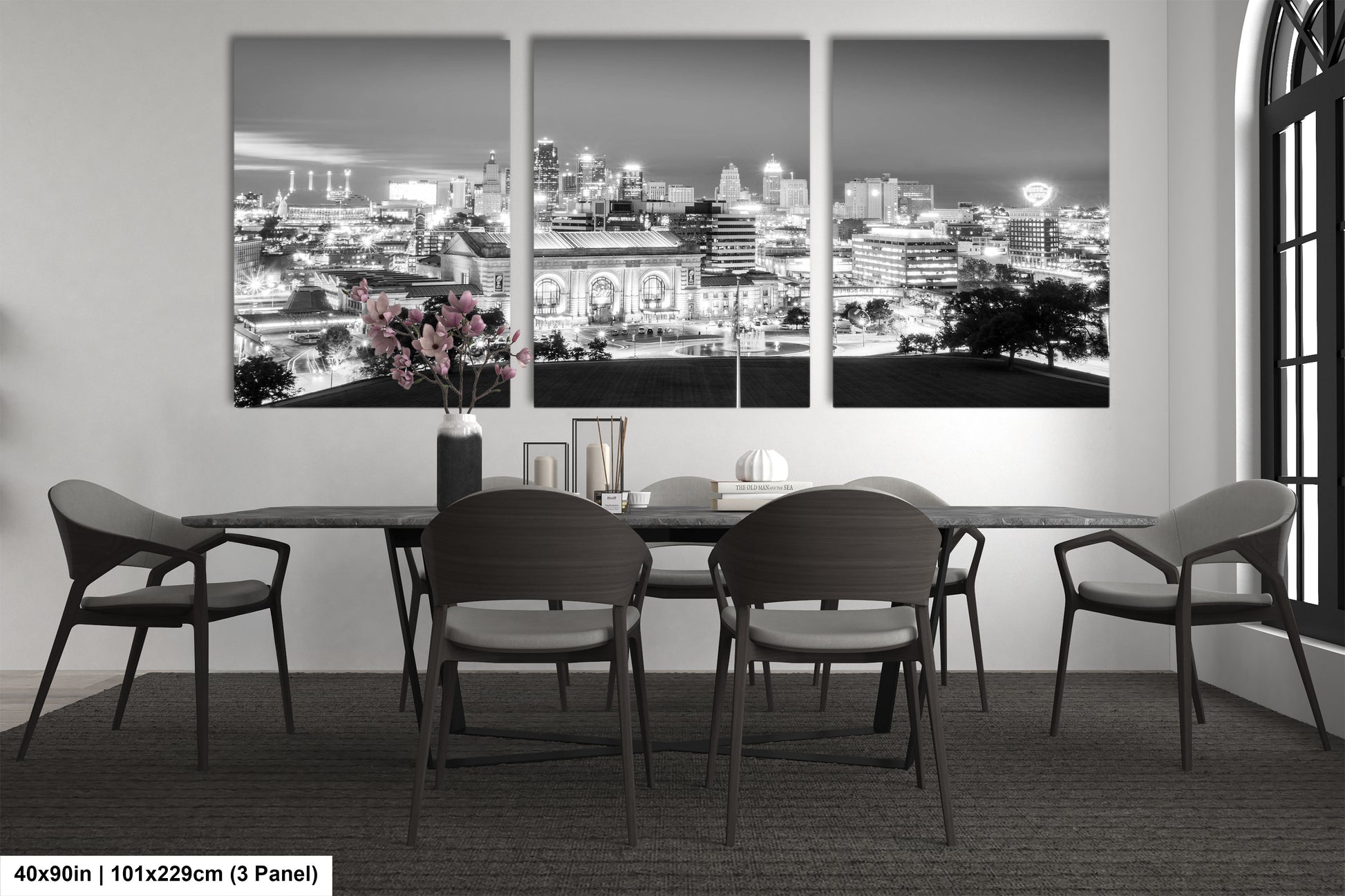 a black and white photo of a dining room