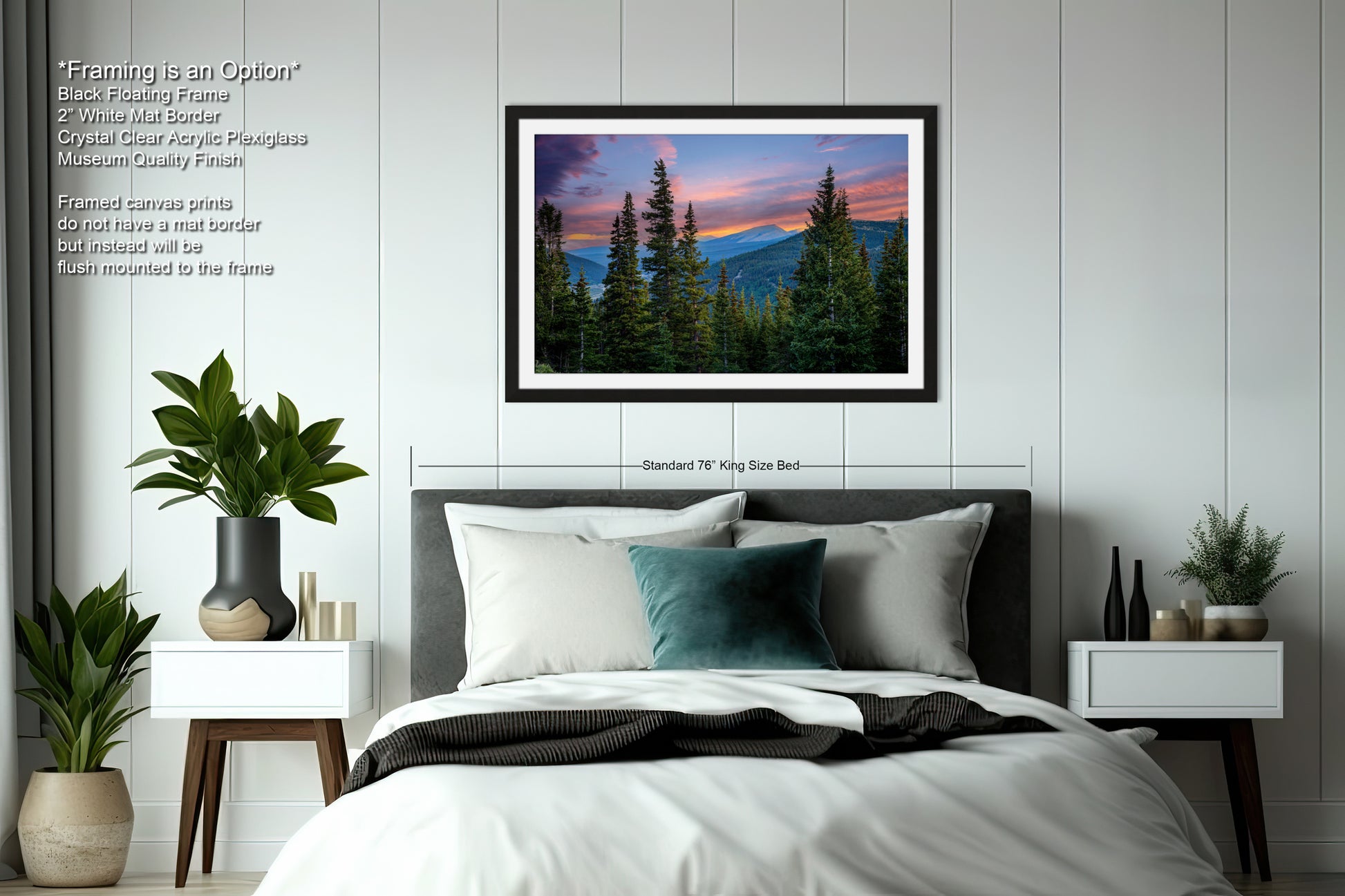 a bedroom with a large framed picture of a mountain landscape hanging on the wall above a bed with white bedding and a green throw pillow.