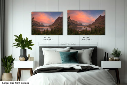 a bedroom with a bed and two pictures on the wall