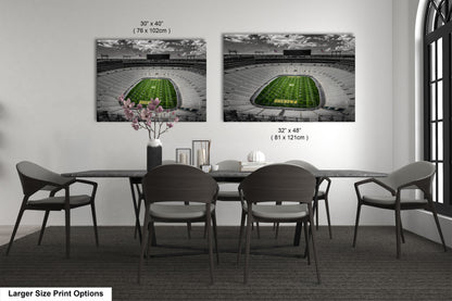 a dining room table with chairs and a vase of flowers