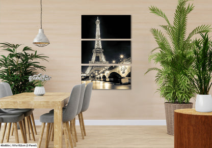 a room with a table and chairs and a picture of the eiffel tower