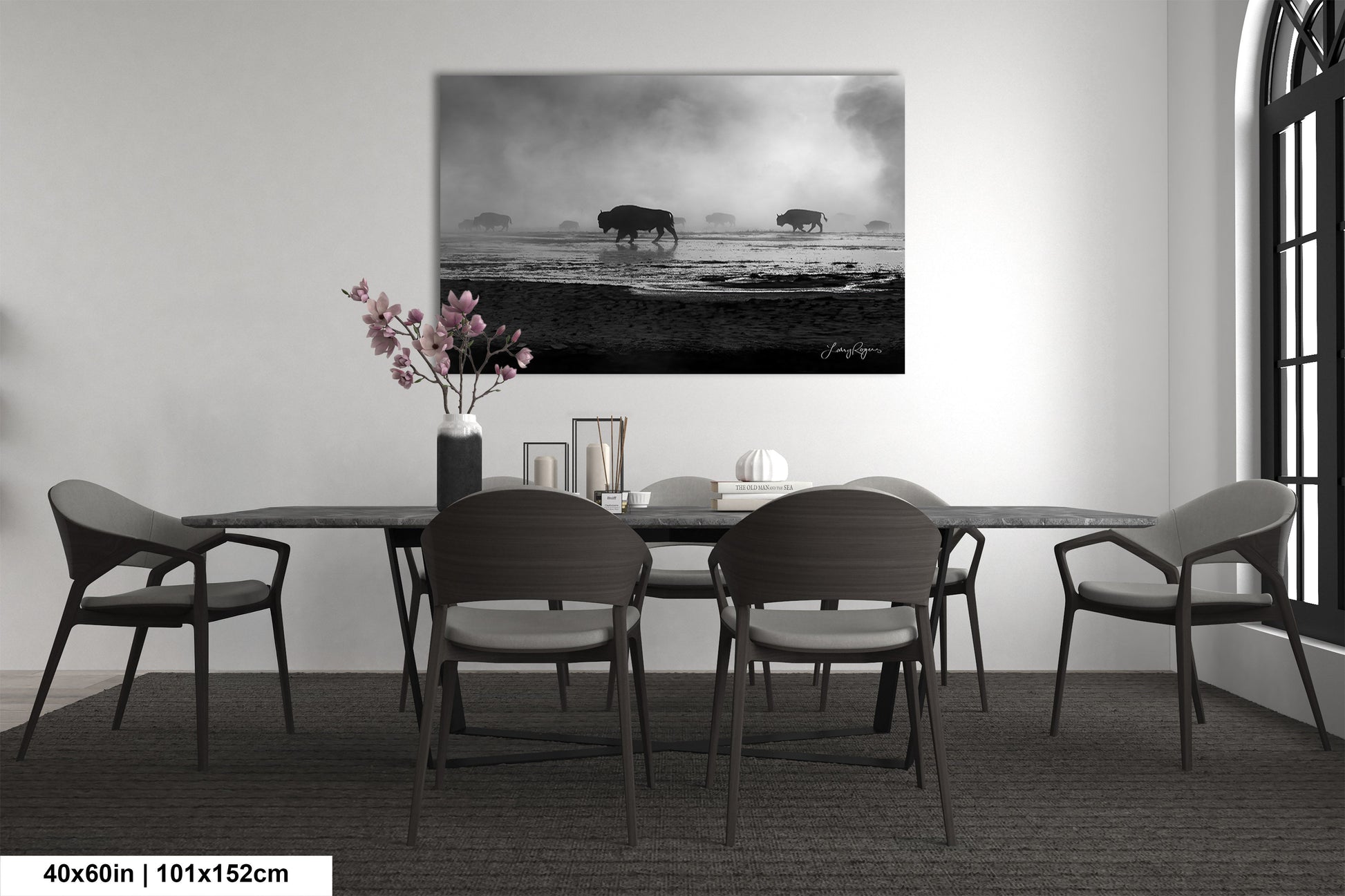 a black and white photo of a dining room table