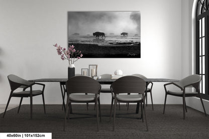 a black and white photo of a dining room table