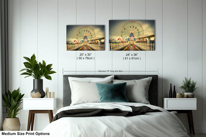 a bedroom with a bed and two pictures on the wall
