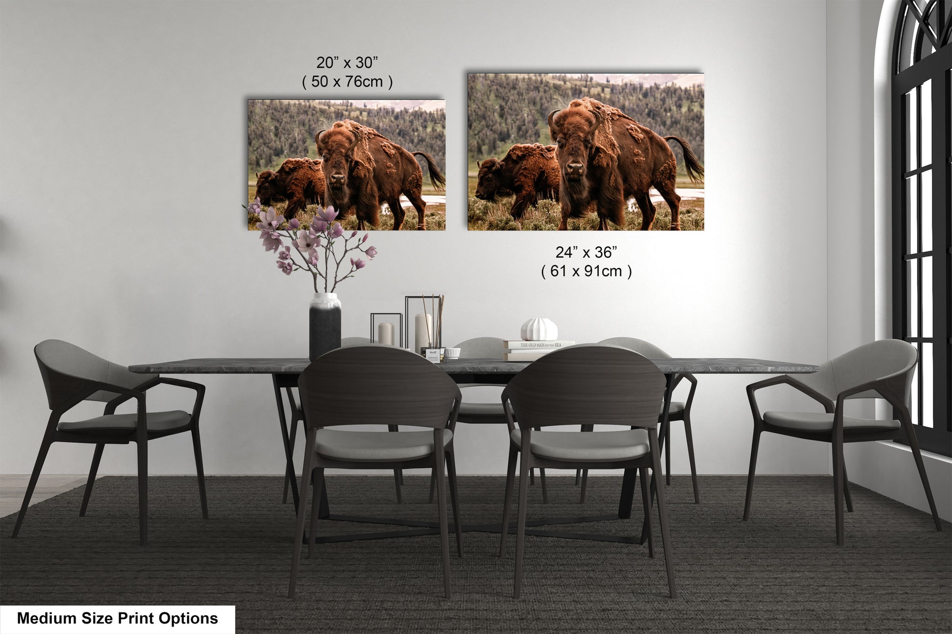 a dining room table with four chairs and a picture of a bison on the wall