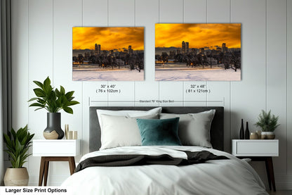 a bedroom with a bed and two pictures on the wall