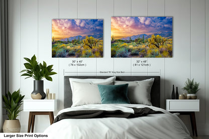 a bedroom with a bed and two pictures on the wall