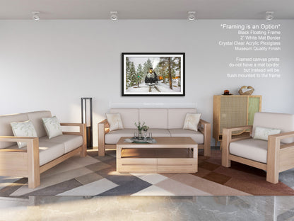a living room filled with furniture and a painting on the wall