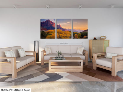 a living room filled with furniture and a painting on the wall