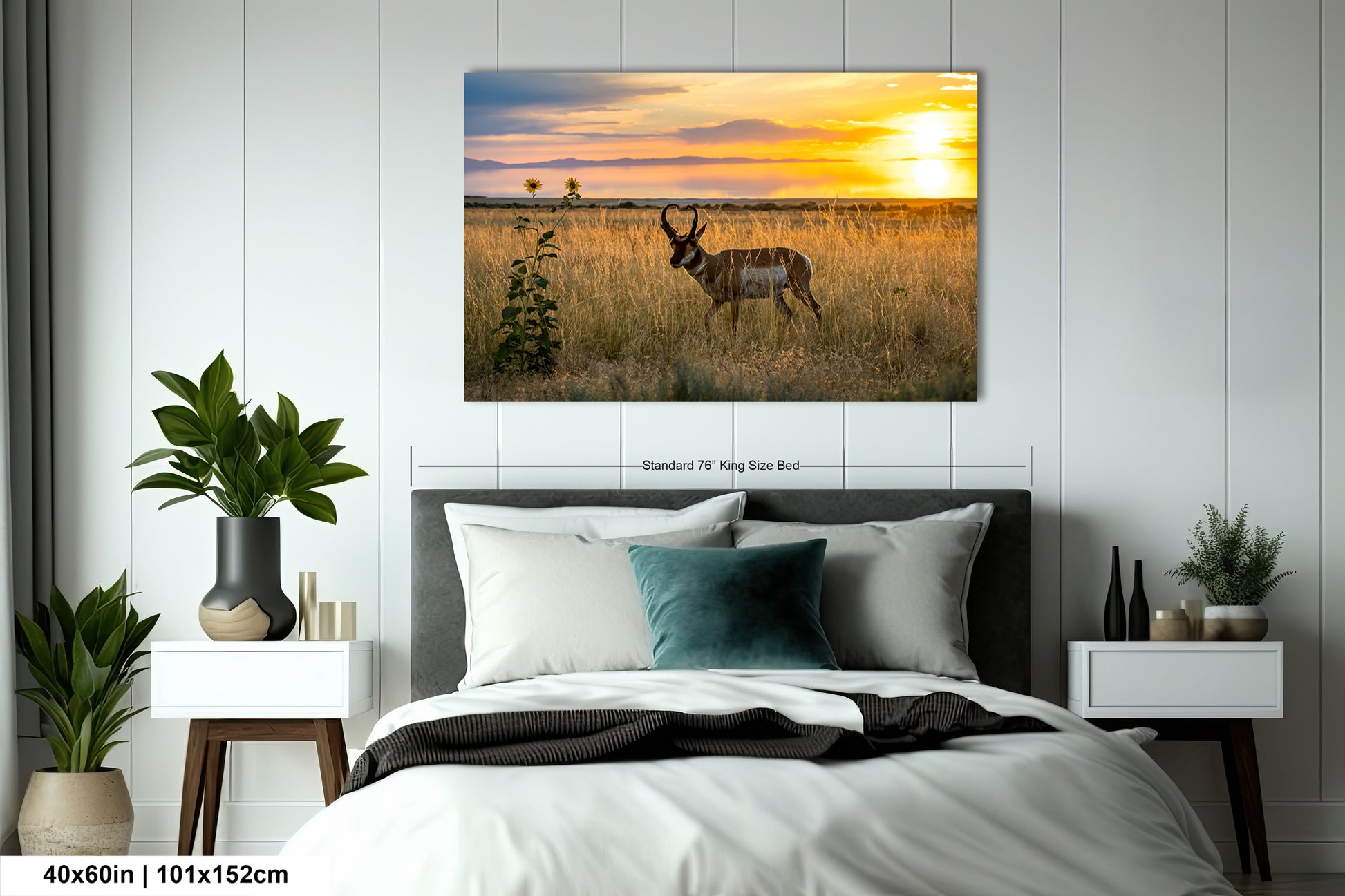 a serene bedroom scene with a large bed, nightstands, and a painting of a gazelle in a field at sunset.
