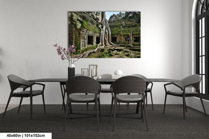 a room with a table and chairs and a painting on the wall