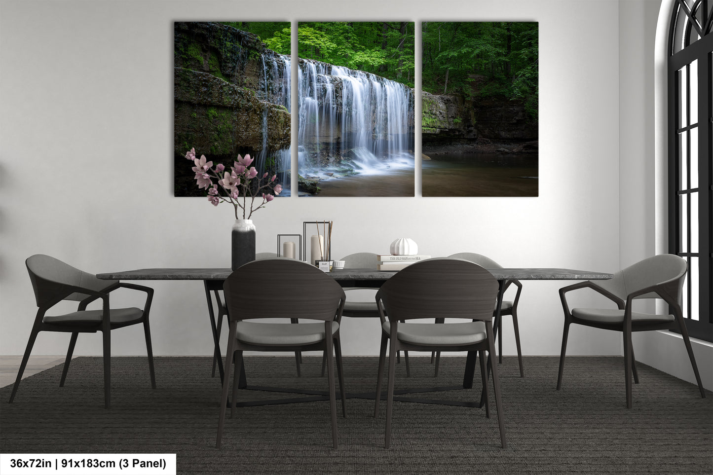 a dining room table with four chairs and a waterfall in the background