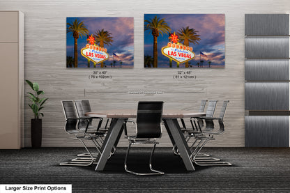 a dining room table with chairs and a large picture of a las vegas sign