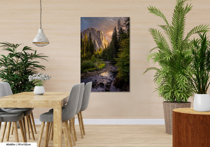 a dining room table with chairs and a painting on the wall