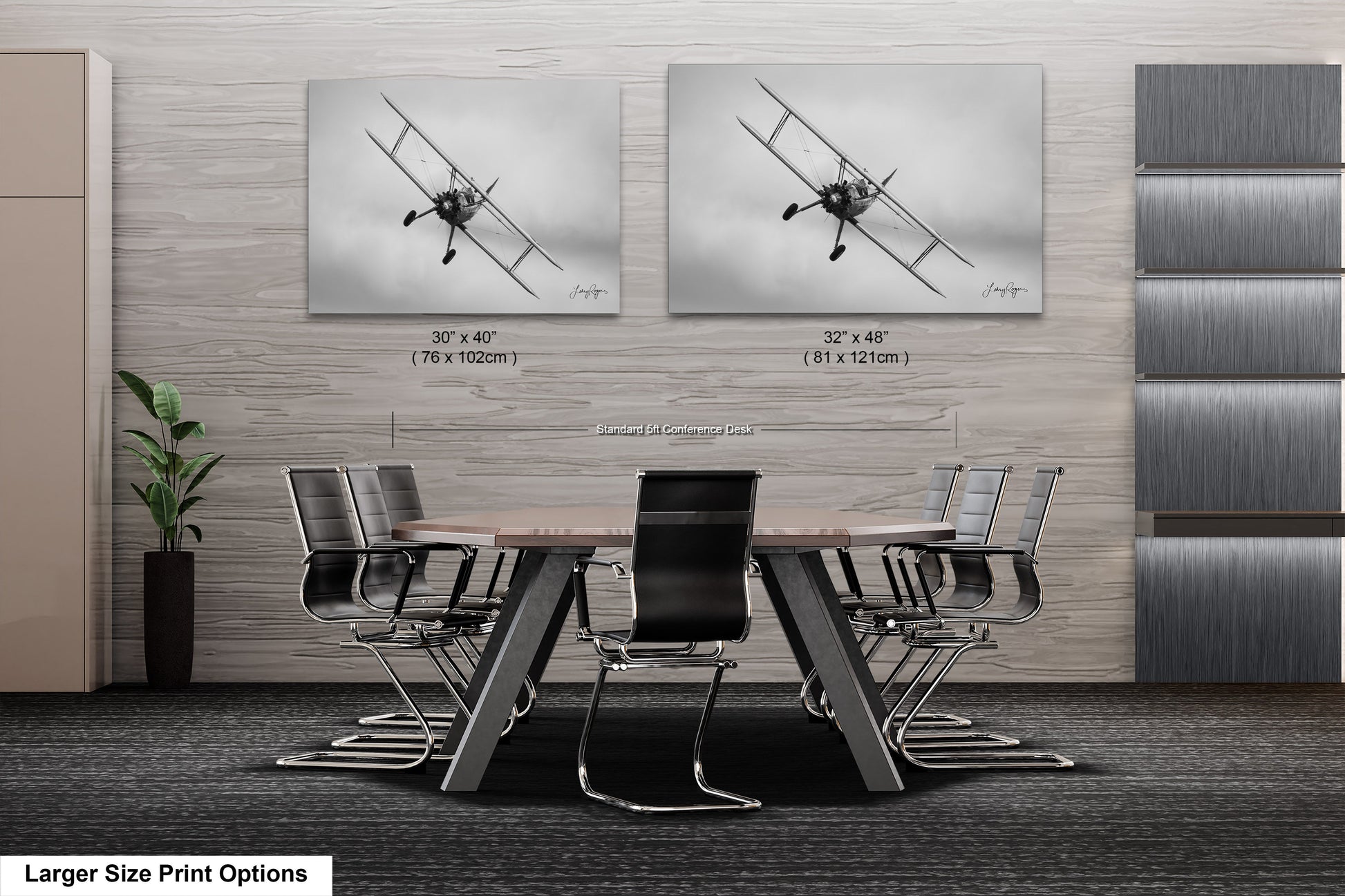 a dining room table with chairs and two pictures on the wall