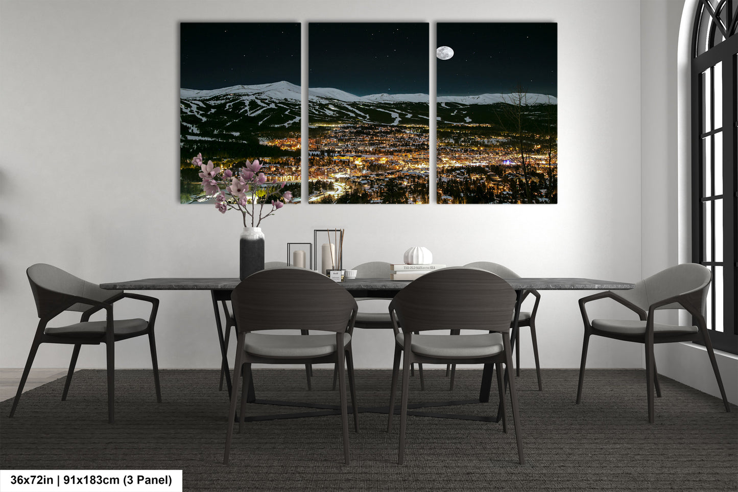 a dining room with a table and four chairs