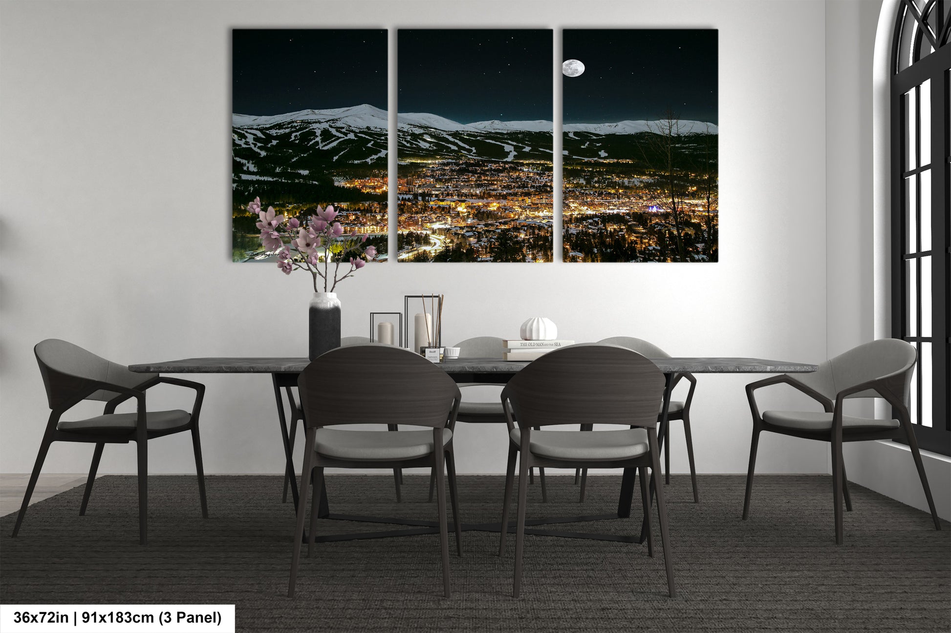 a dining room with a table and four chairs