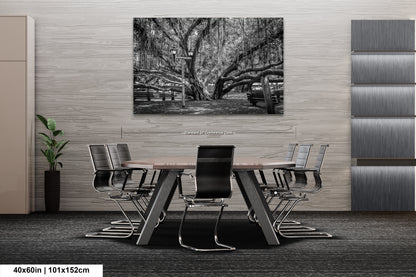 a black and white photo of a table and chairs