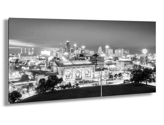 a black and white photo of a city at night