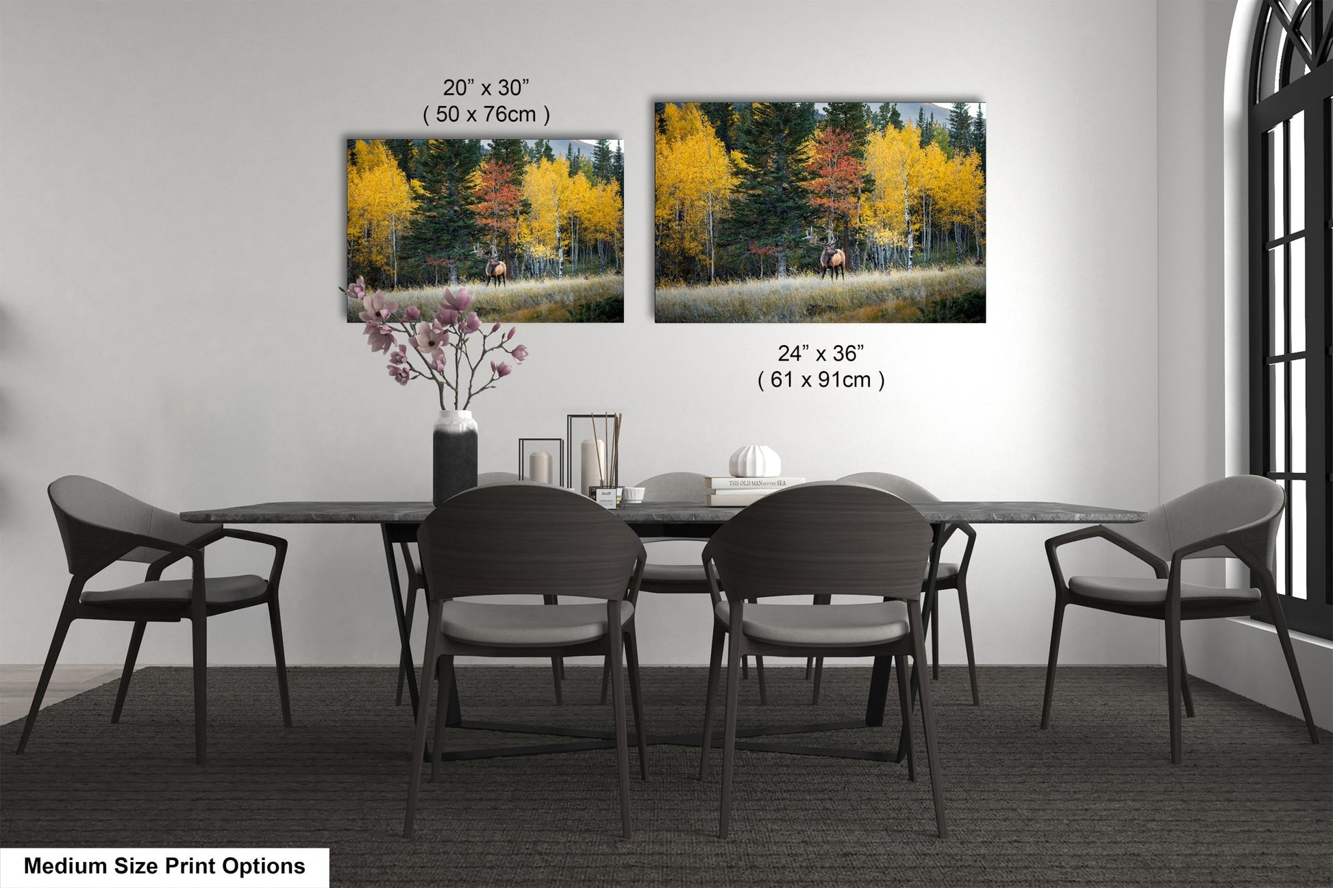 a dining table with four chairs and a vase of flowers