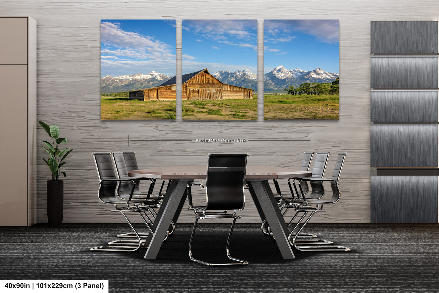 a dining room table with chairs in front of a barn and mountains