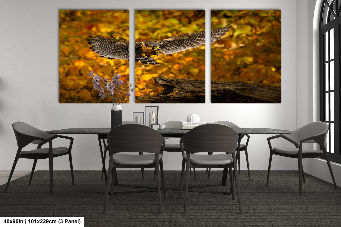 a dining room table with chairs and a painting of an owl on it