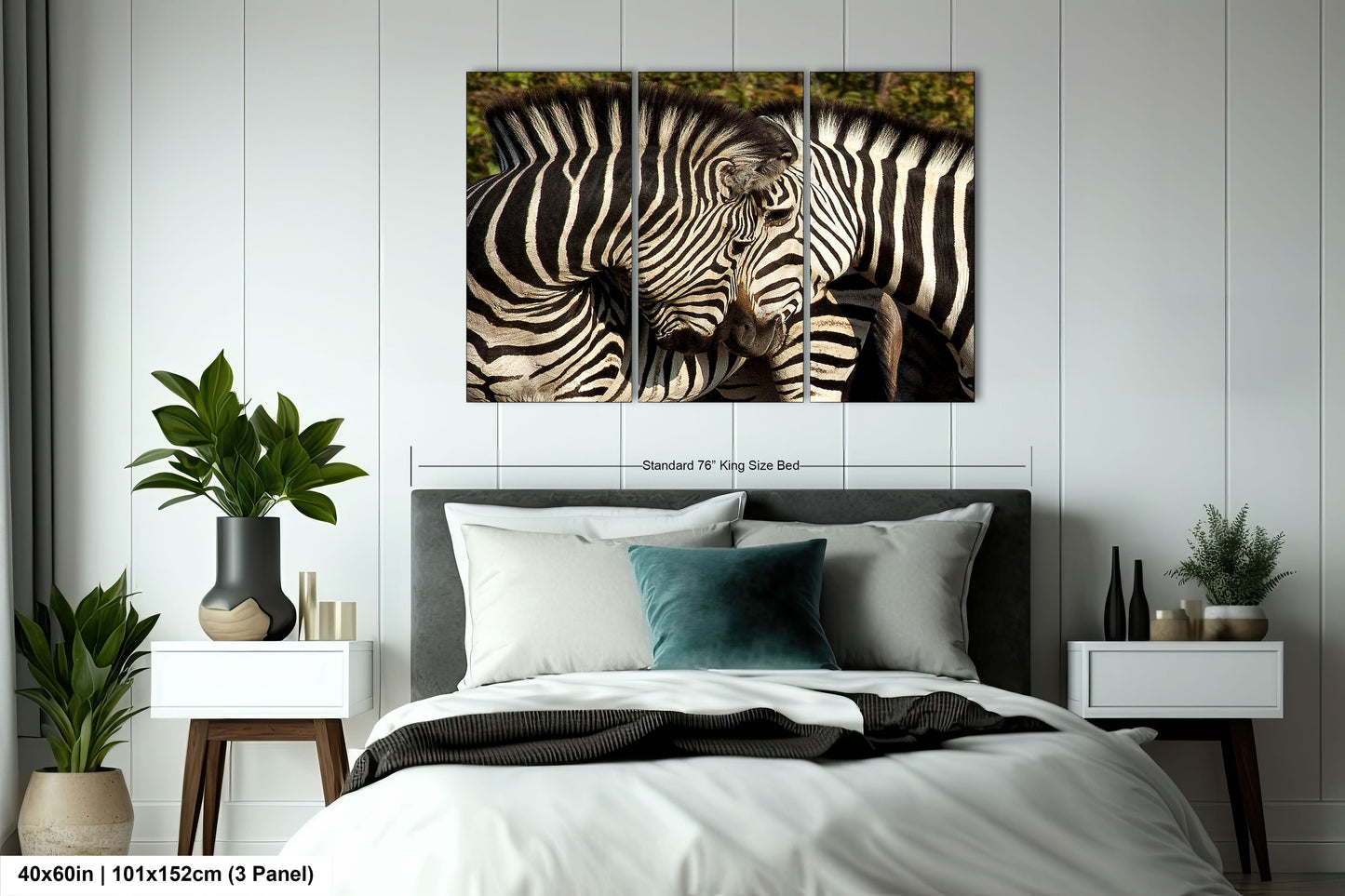 a couple of zebra standing next to each other on a bed