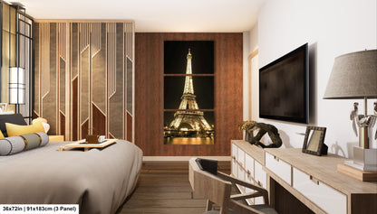 a room with a bed, desk, lamp and television