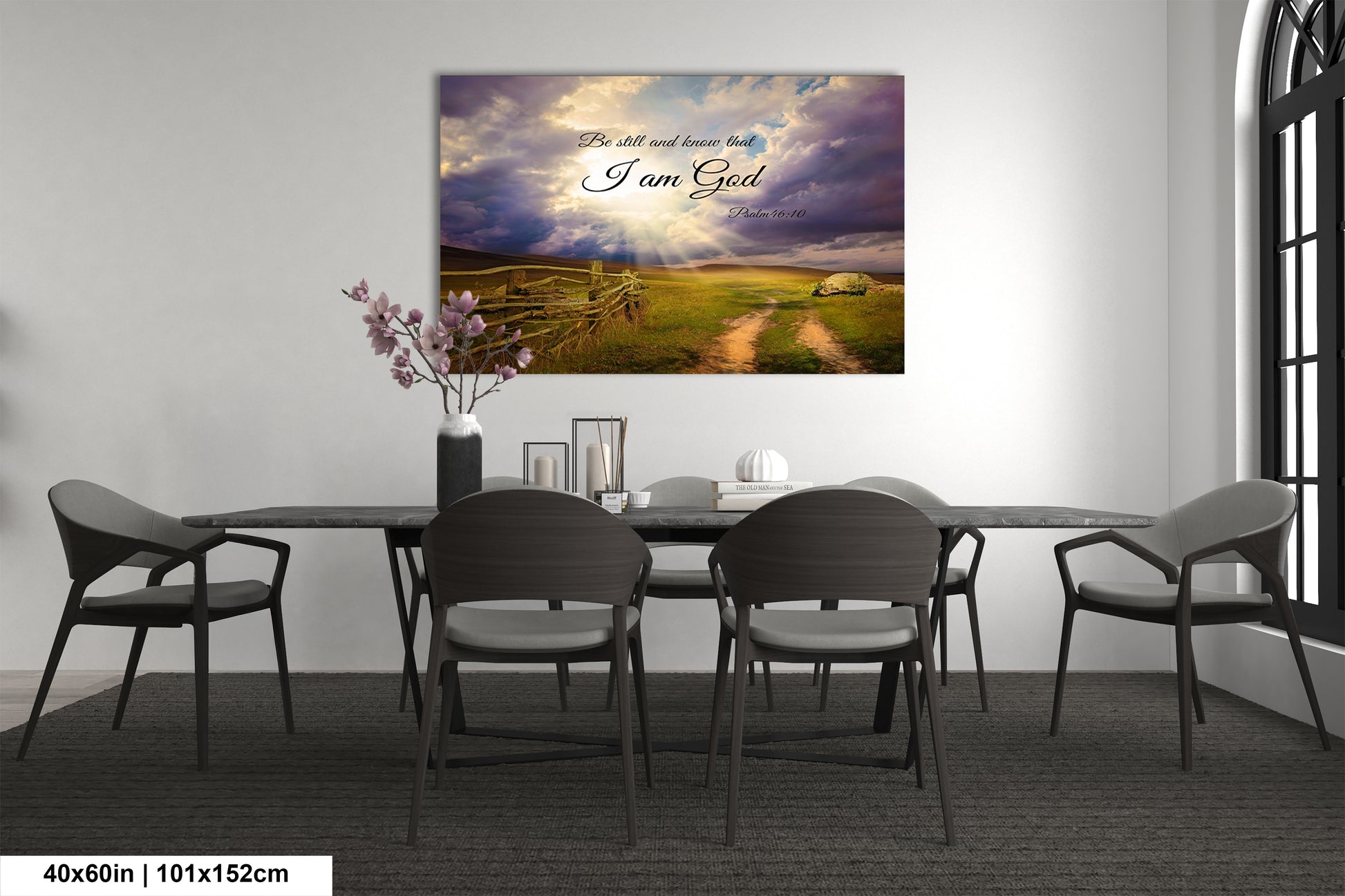 a dining room table with chairs and a painting on the wall