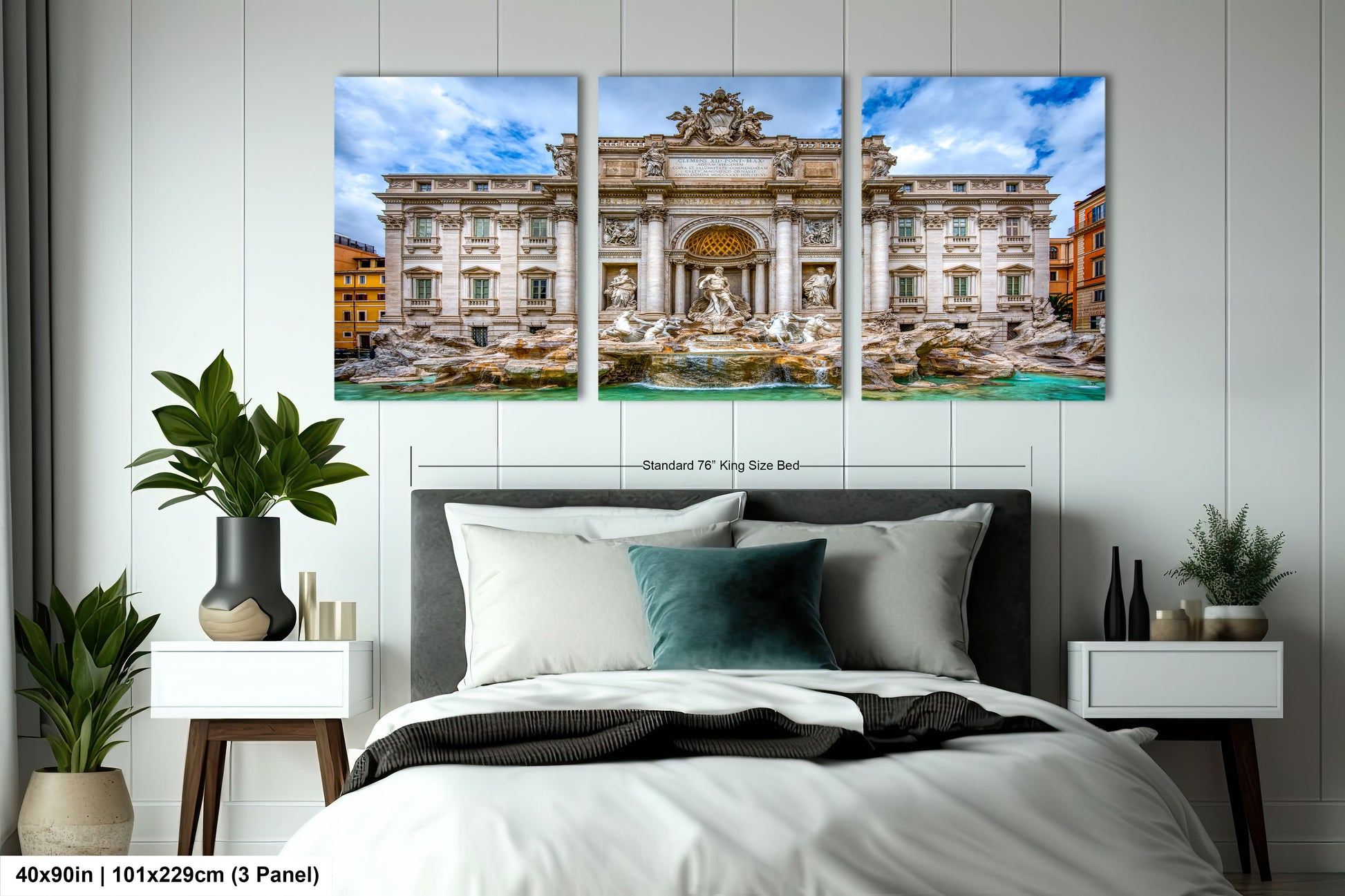 a bedroom with a bed and two paintings on the wall