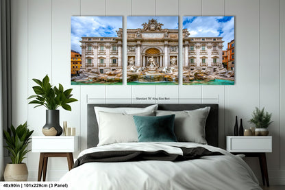 a bedroom with a bed and two paintings on the wall