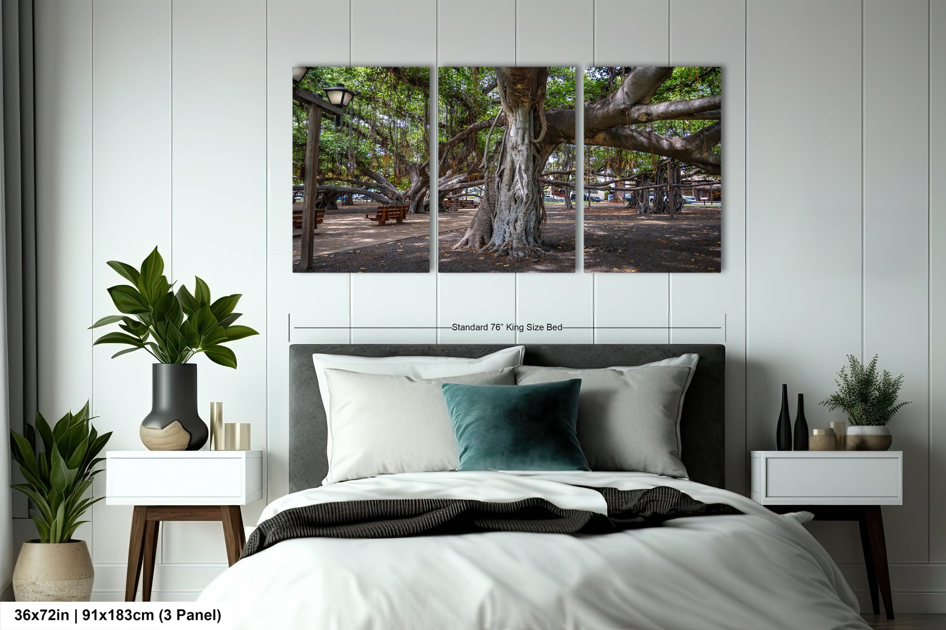a bed with a white comforter and two paintings on the wall