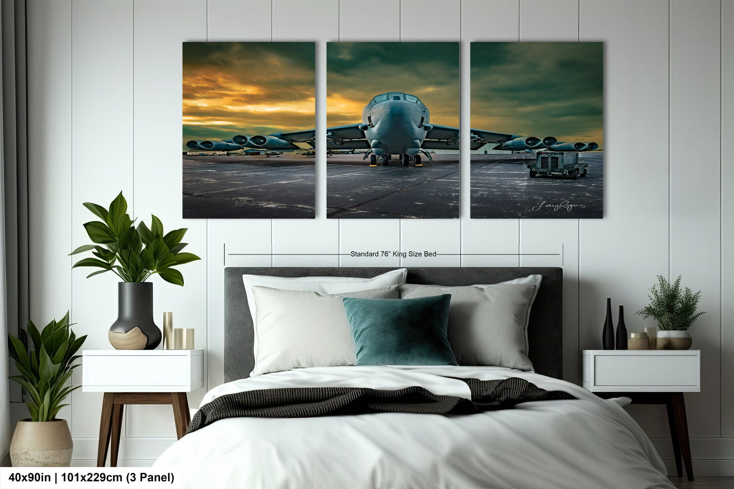 a bedroom with a bed and three paintings on the wall