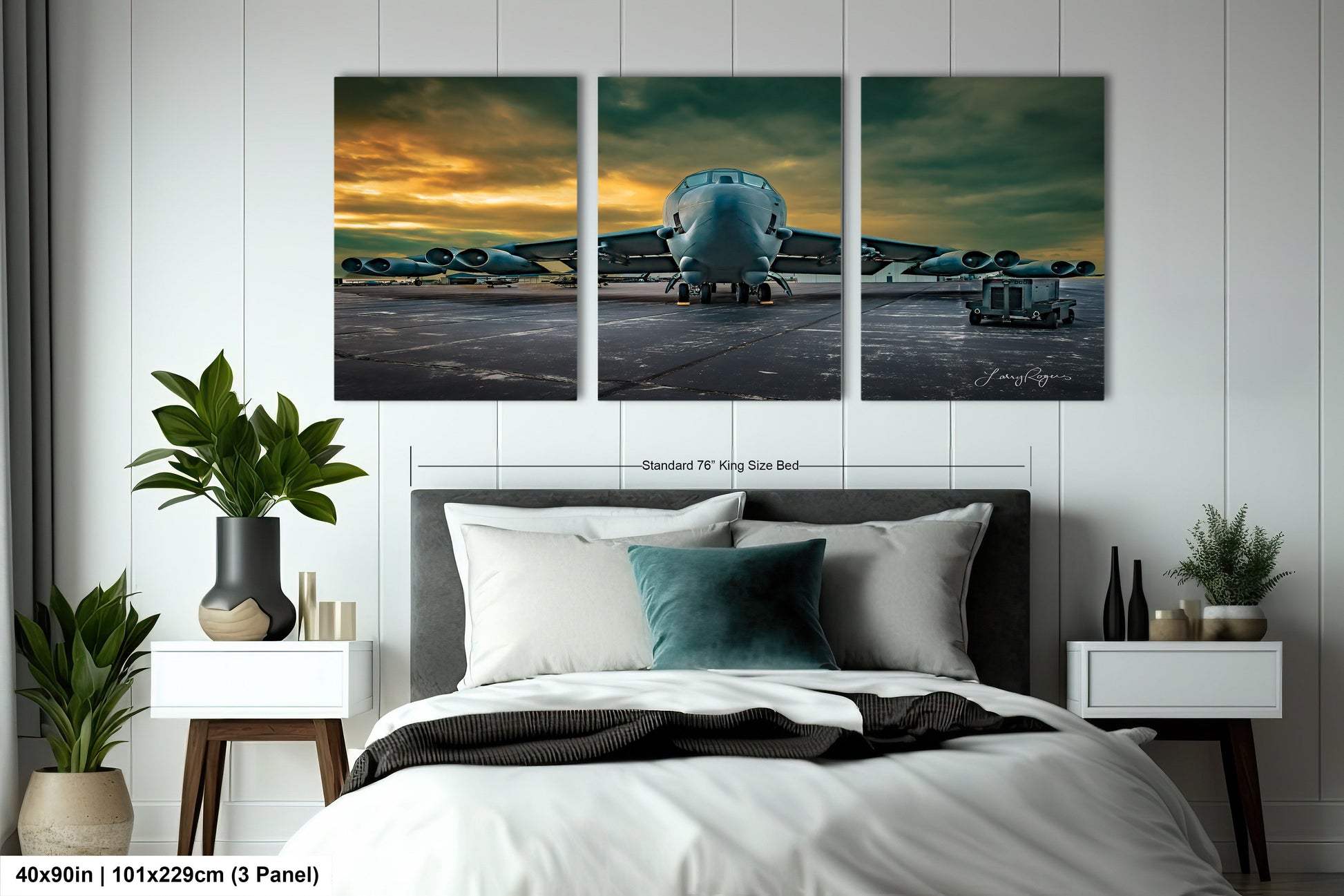 a bedroom with a bed and three paintings on the wall
