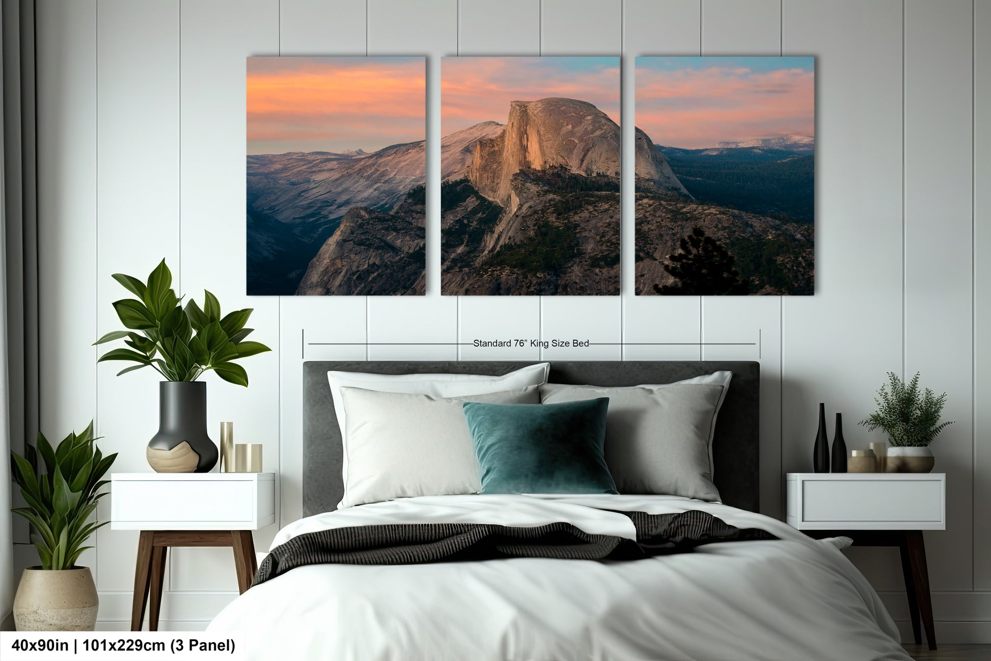 a bed room with a neatly made bed and two pictures on the wall
