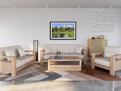 a living room filled with furniture and a painting on the wall