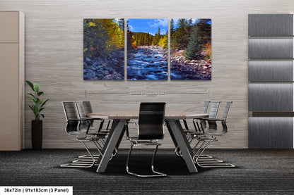 a dining room table with chairs and a painting on the wall