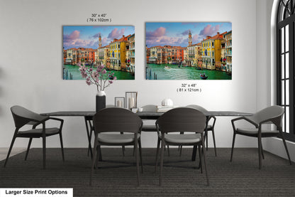 a dining table with four chairs and a vase of flowers