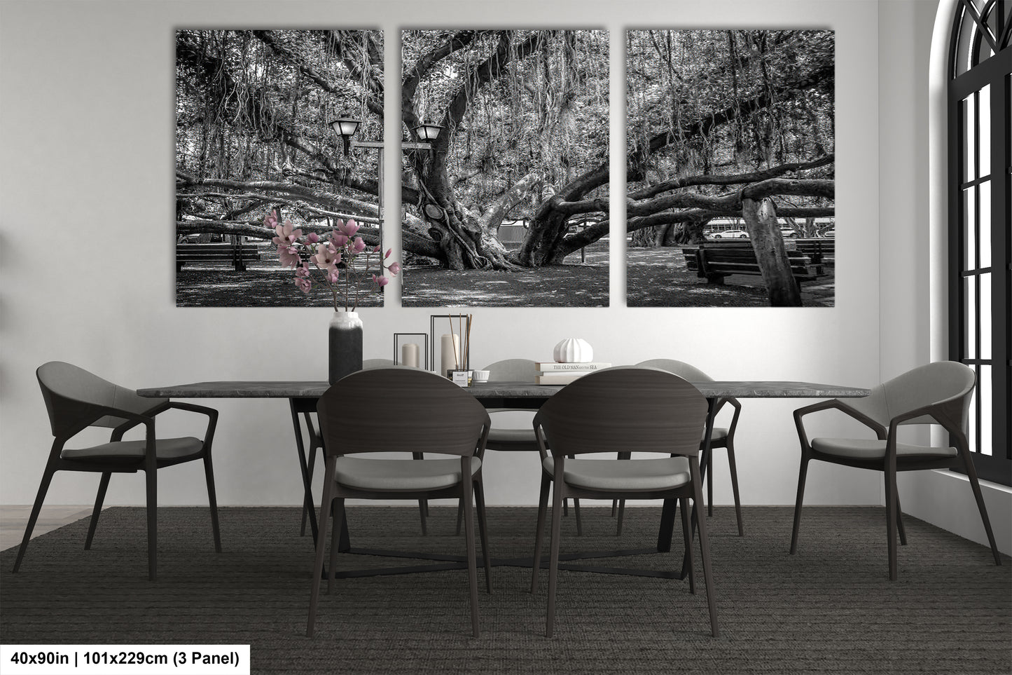 a black and white photo of a dining room table