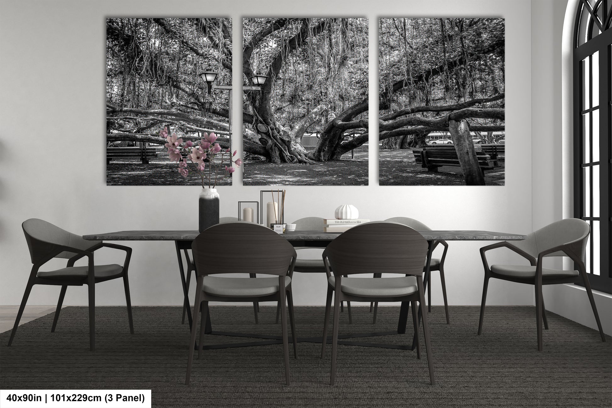 a black and white photo of a dining room table