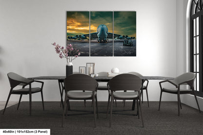 a dining room table with chairs and a painting on the wall