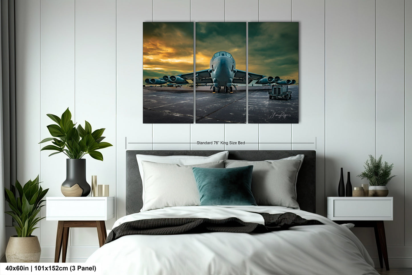 a bedroom with a bed and a painting on the wall