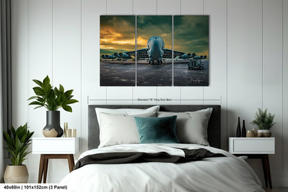 a bedroom with a bed and a painting on the wall
