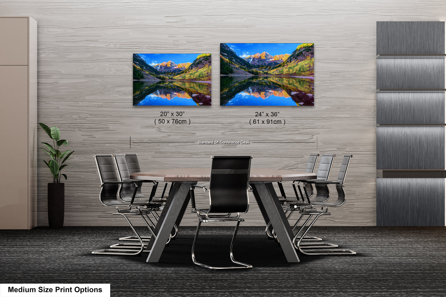 a dining room table with four chairs and two pictures on the wall